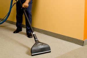 Commercial Cleaning Services in Scottsdale, AZ worker cleaning carpets in office building